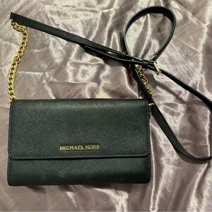 Black Micheal Kors clutch with strap 🖤